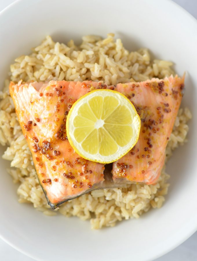 Quick and easy Honey Dijon Mustard Salmon recipe for a weeknight meal that is ready in under 20 minutes. My new go-to dinner idea!