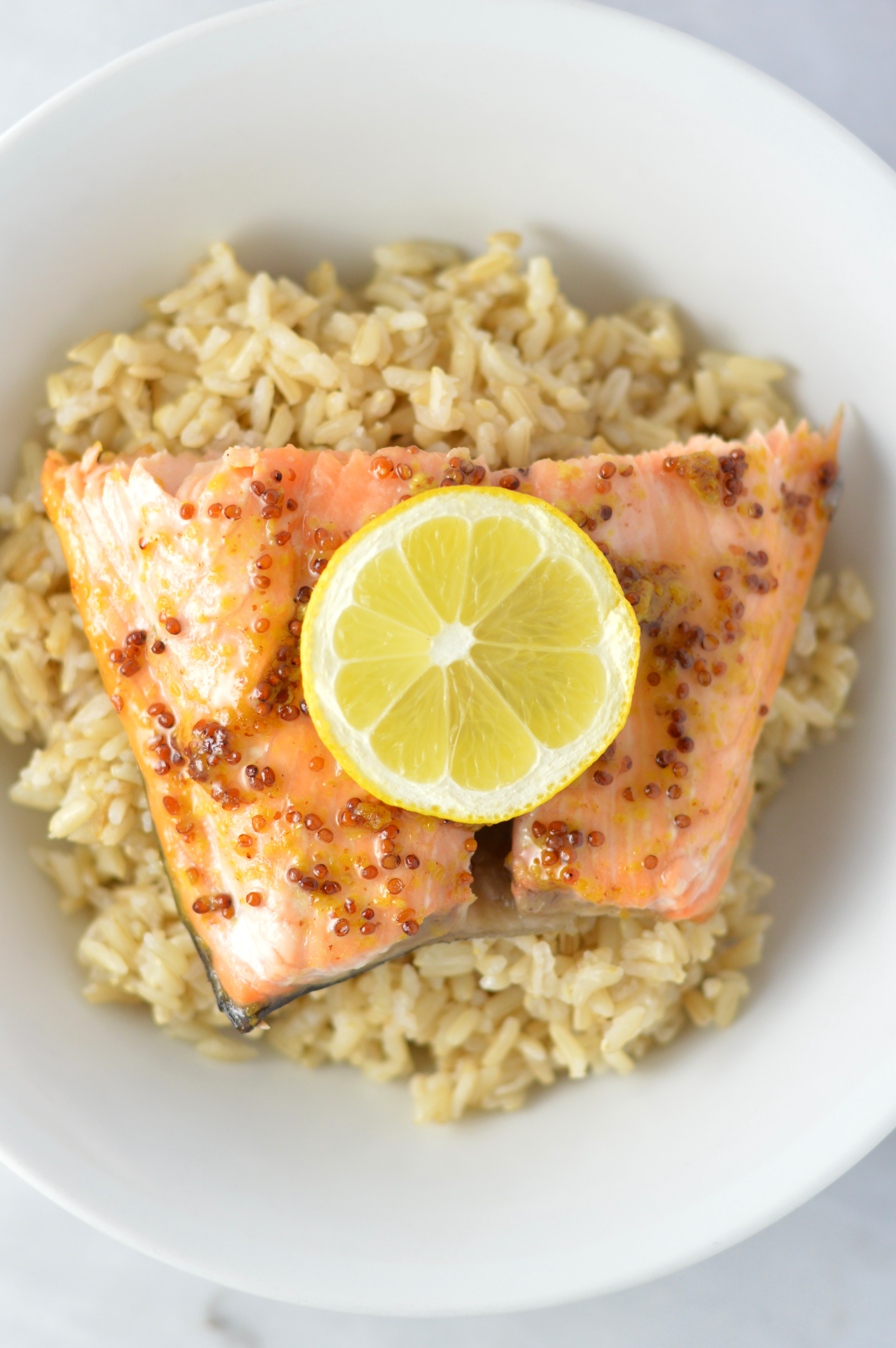 Quick and easy Honey Dijon Mustard Salmon recipe for a weeknight meal that is ready in under 20 minutes. My new go-to dinner idea!