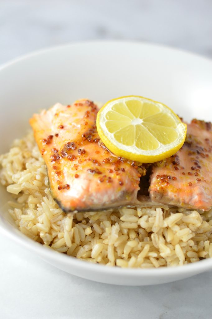 Quick and easy Honey Dijon Mustard Salmon recipe for a weeknight meal that is ready in under 20 minutes. My new go-to dinner idea!