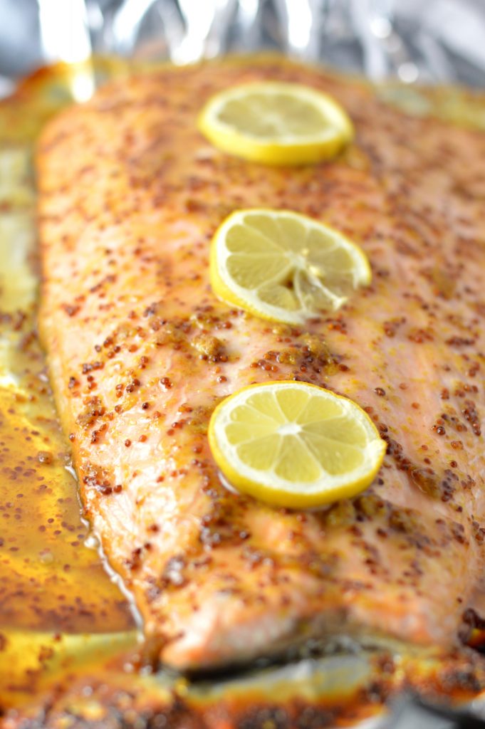 Quick and easy Honey Dijon Mustard Salmon recipe for a weeknight meal that is ready in under 20 minutes. My new go-to dinner idea!