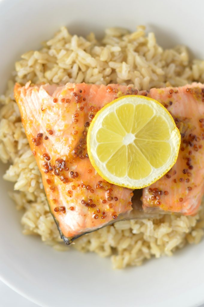 Quick and easy Honey Dijon Mustard Salmon recipe for a weeknight meal that is ready in under 20 minutes. My new go-to dinner idea!