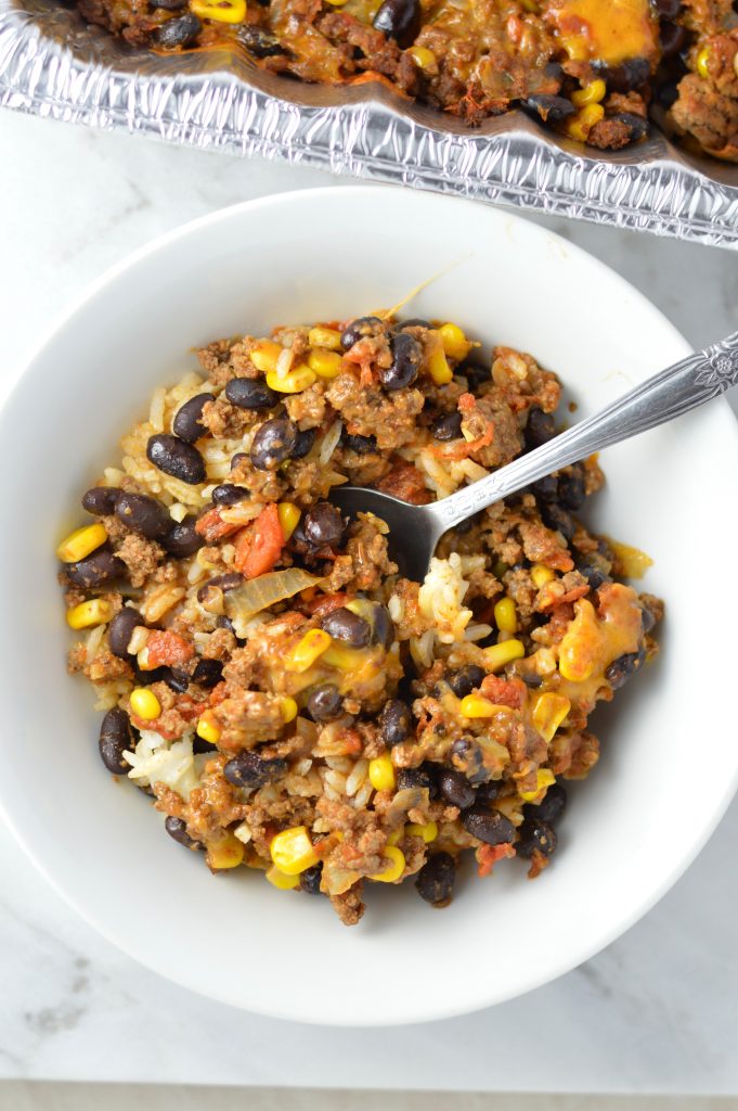  Easy Taco Rice Casserole Freezer Meal made with beans and ground beef. Great recipe to make ahead for the week as your weekly dinner meal prep.