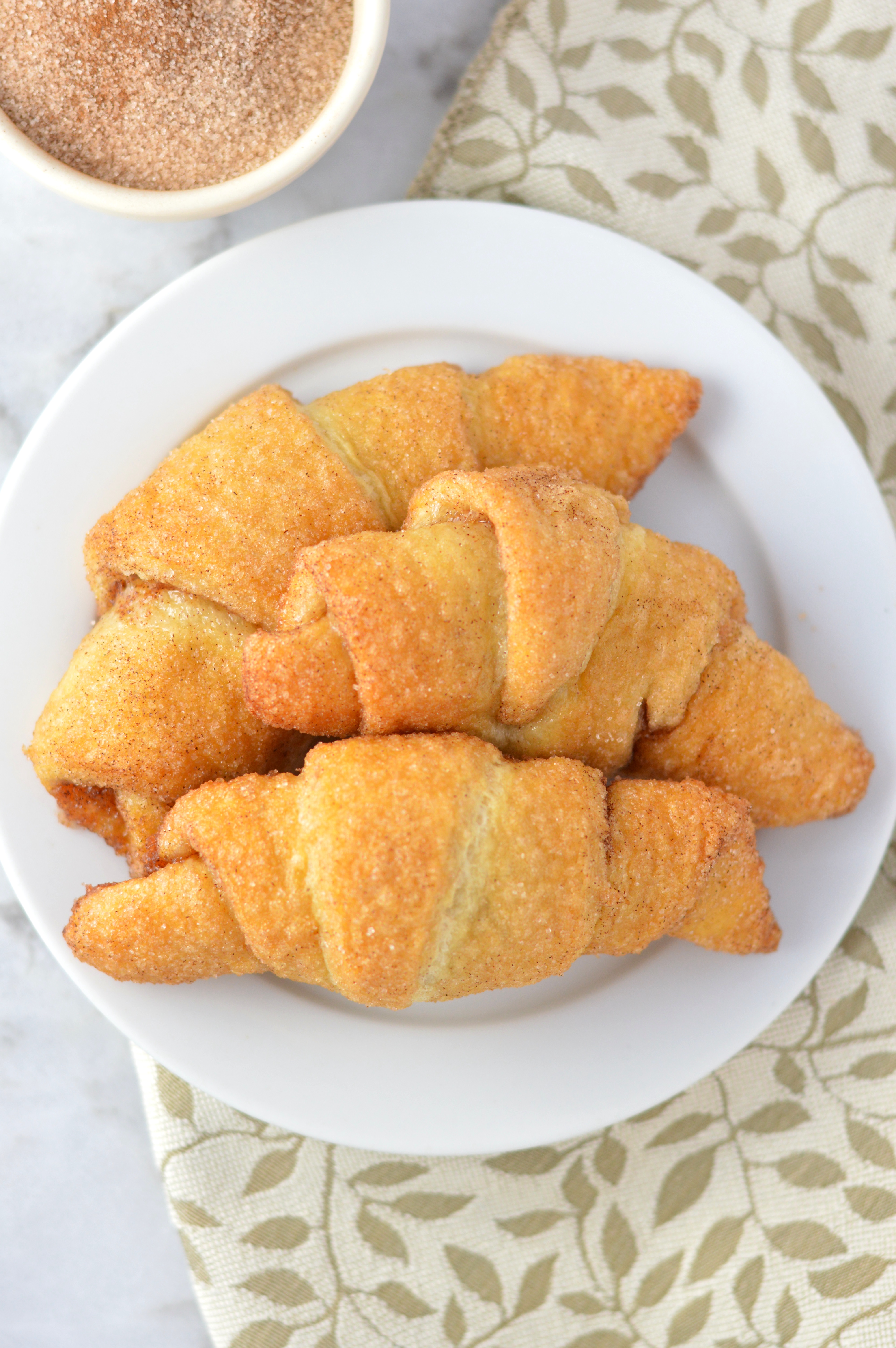 Easy Churro Crescent Rolls recipe makes a quick and simple dessert or breakfast idea. Made with only 3 ingredients and ready in under 20 minutes.