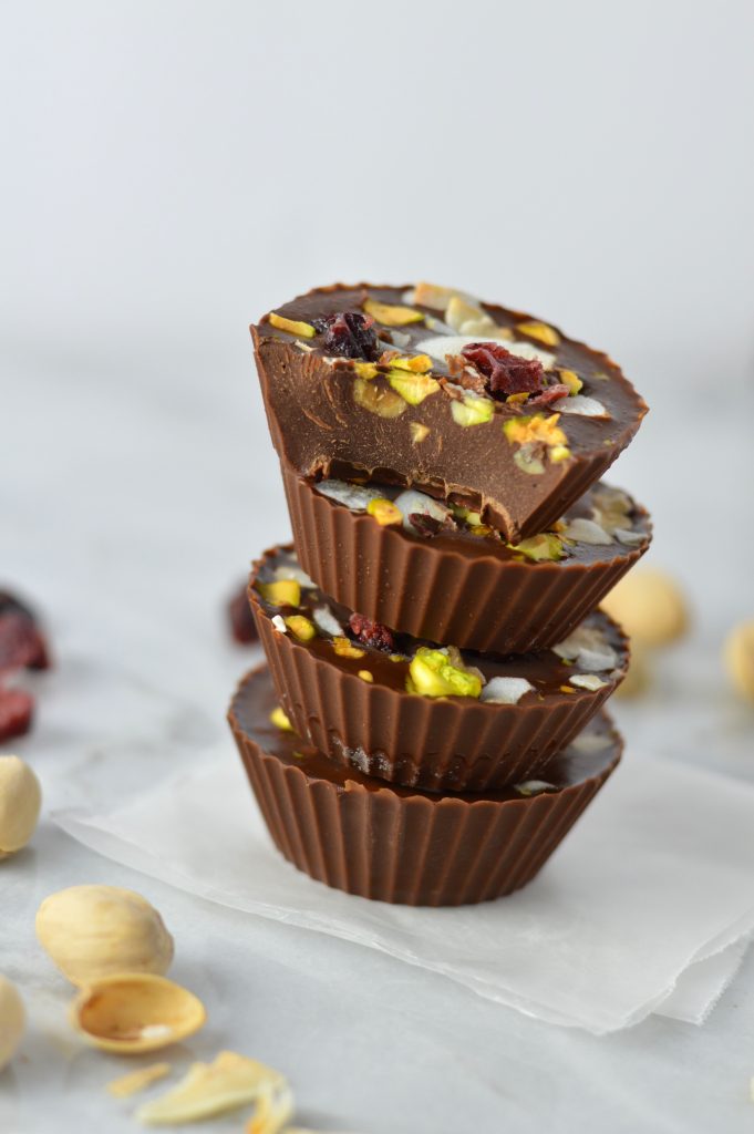 Pistachio, Cranberry and Coconut Peanut Butter Chocolate Cups recipe, that is so quick and easy to make. No bake, vegan and gluten free, they make a great last minute dessert idea.