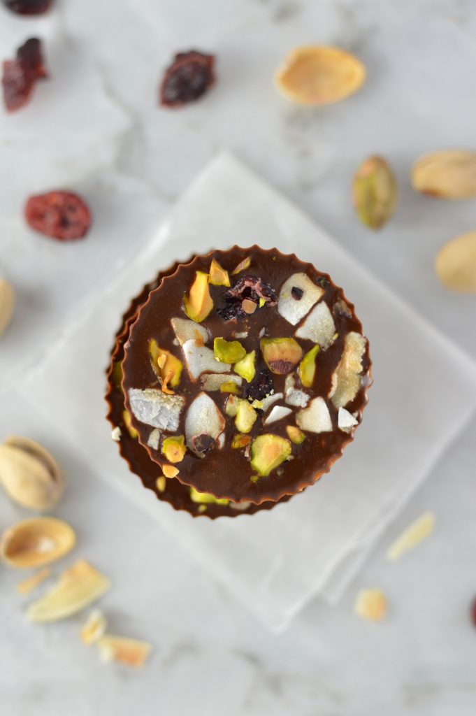 Pistachio, Cranberry and Coconut Peanut Butter Chocolate Cups recipe, that is so quick and easy to make. No bake, vegan and gluten free, they make a great last minute dessert idea.