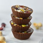 Pistachio, Cranberry and Coconut Peanut Butter Chocolate Cups recipe, that is so quick and easy to make. No bake, vegan and gluten free, they make a great last minute dessert idea.