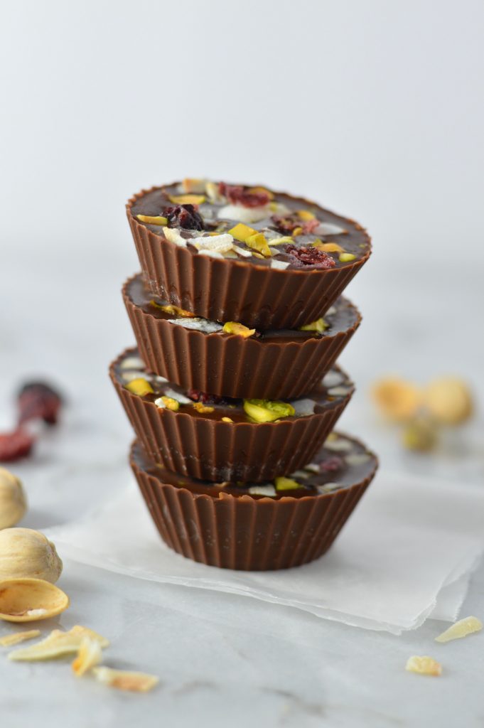 Pistachio, Cranberry and Coconut Peanut Butter Chocolate Cups recipe, that is so quick and easy to make. No bake, vegan and gluten free, they make a great last minute dessert idea.