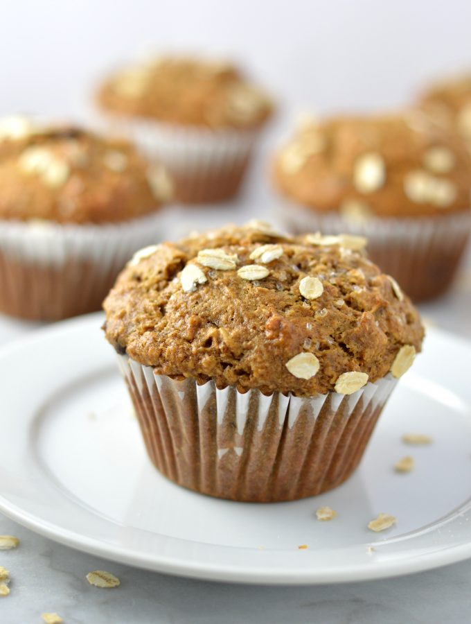 Healthy Whole Wheat Banana and Date Muffins recipe that are moist and super easy to make. Made with oats, bran and chocolate chips, they make a great grab and go breakfast idea.