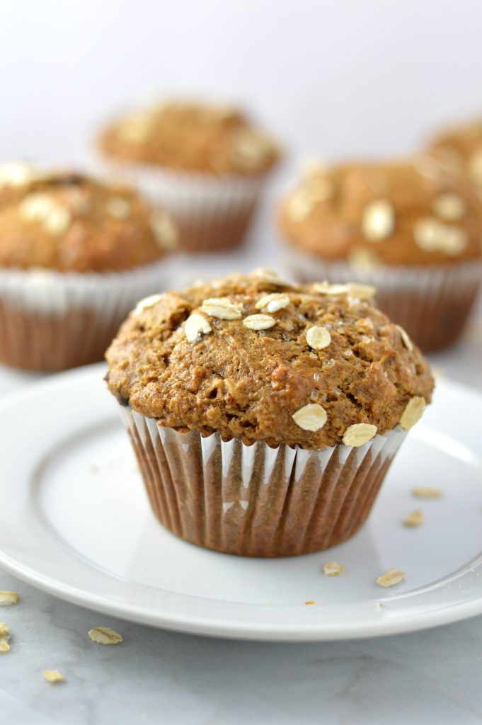 Healthy Whole Wheat Banana and Date Muffins recipe that are moist and super easy to make. Made with oats, bran and chocolate chips, they make a great grab and go breakfast idea.