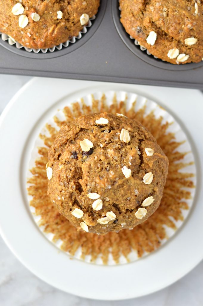 Healthy Whole Wheat Banana and Date Muffins recipe that are moist and super easy to make. Made with oats, bran and chocolate chips, they make a great grab and go breakfast idea.