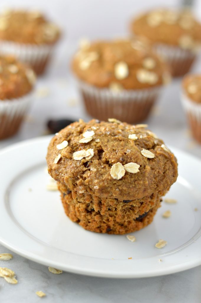 Healthy Whole Wheat Banana and Date Muffins recipe that are moist and super easy to make. Made with oats, bran and chocolate chips, they make a great grab and go breakfast idea.