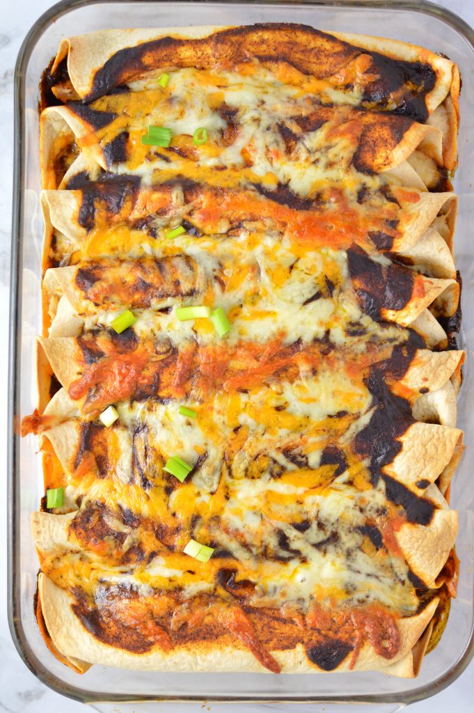 Easy spicy Chicken Enchiladas recipe with homemade enchilada sauce. The ultimate comfort food, it's a great dinner idea to use up your leftover chicken