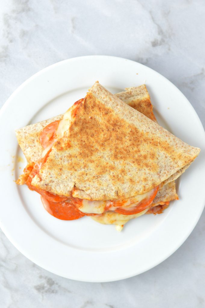 Easy Pepperoni Pizza Quesadilla recipe made with only 4 ingredients: flour tortillas, tomato paste, mozzarella cheese and pepperoni.