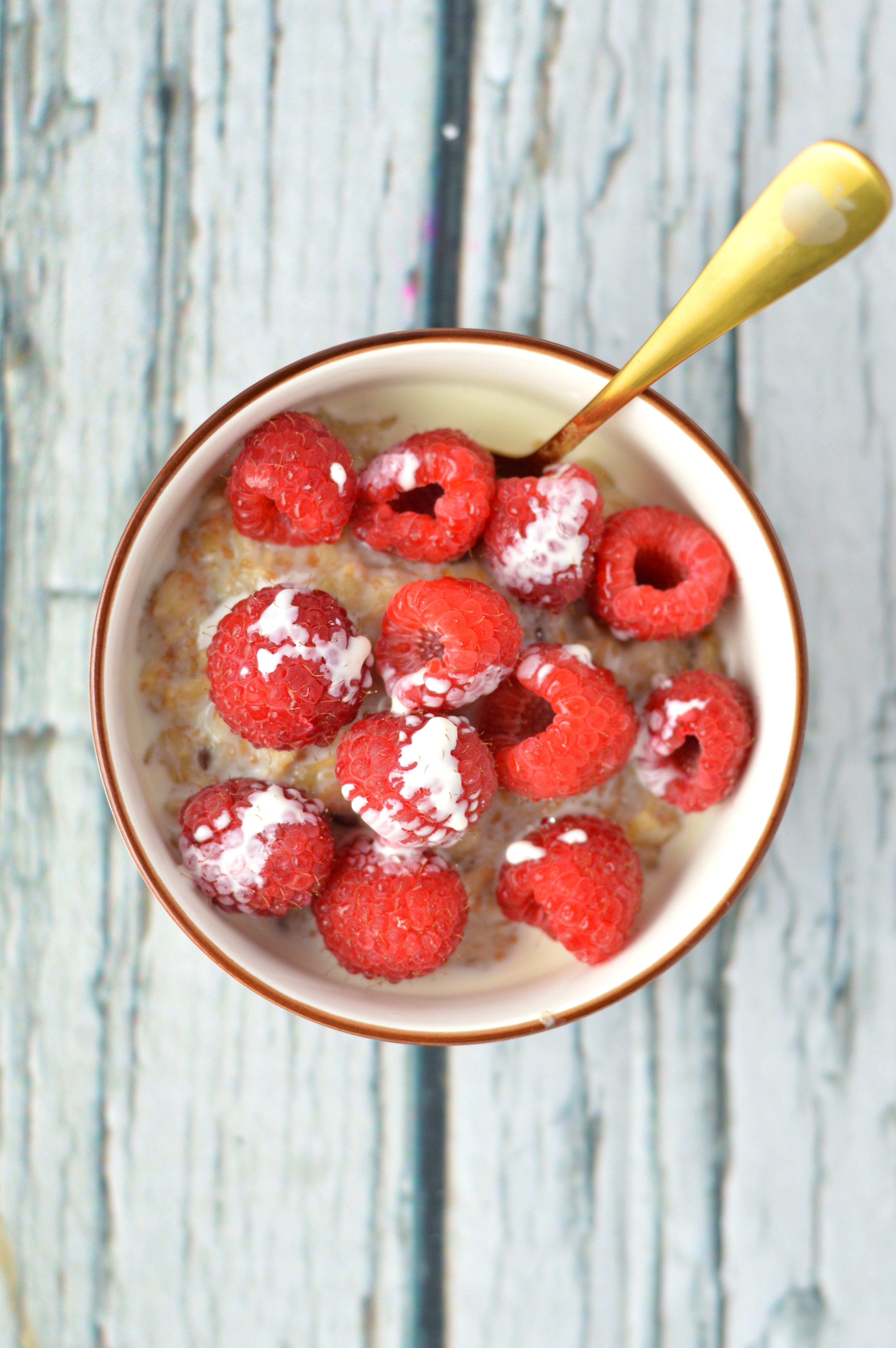 Quick and easy Raspberries and Cream Oatmeal recipe. I love making this in the summer with fresh raspberries and whipping cream.