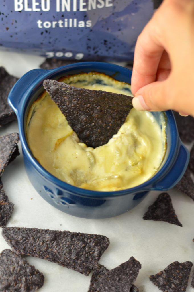 Easy Monterey Jack Artichoke Dip made with mayo and yogurt. Baked to perfection, this dip is perfect with tortilla chips as a snack or appetizer.