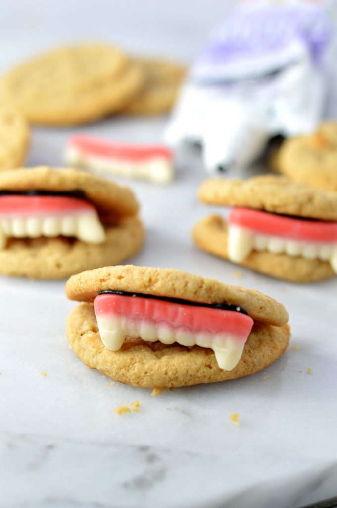 These Peanut Butter Vampire Cookies are the perfect quick and easy dessert recipe to make for your Halloween party. Super fun activity to do with kids.