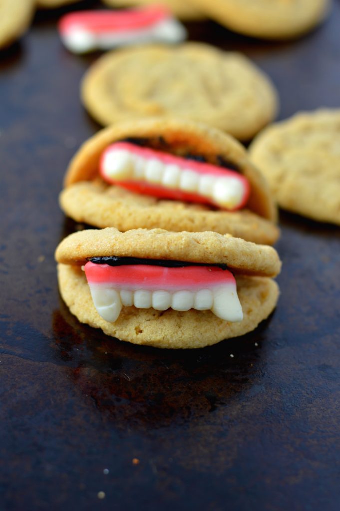 These Peanut Butter Vampire Cookies are the perfect quick and easy dessert recipe to make for your Halloween party. Super fun activity to do with kids.