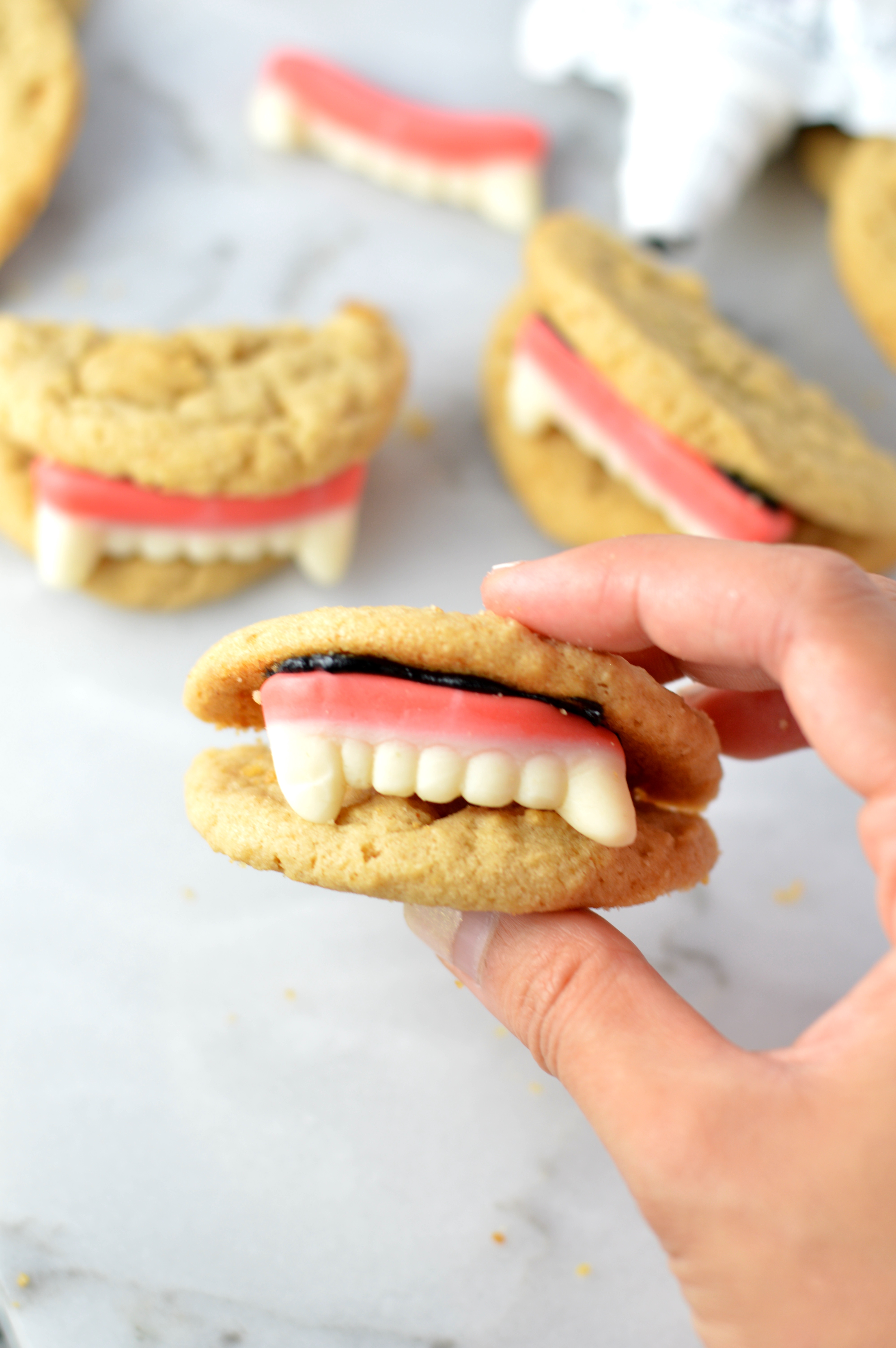 These Peanut Butter Vampire Cookies are the perfect quick and easy dessert recipe to make for your Halloween party. Super fun activity to do with kids.