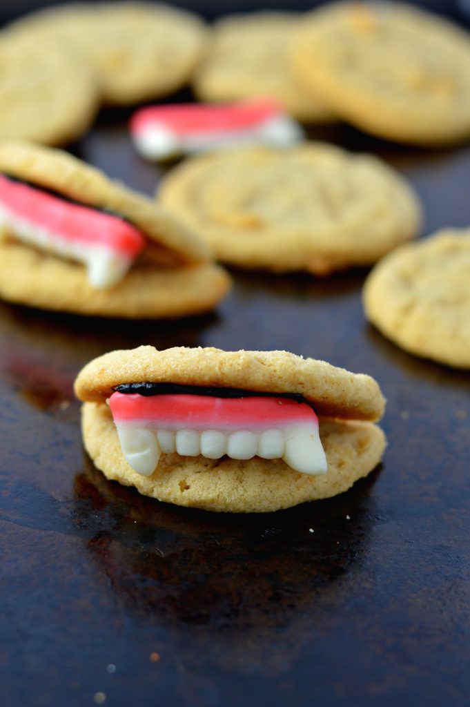 These Peanut Butter Vampire Cookies are the perfect quick and easy dessert recipe to make for your Halloween party. Super fun activity to do with kids.