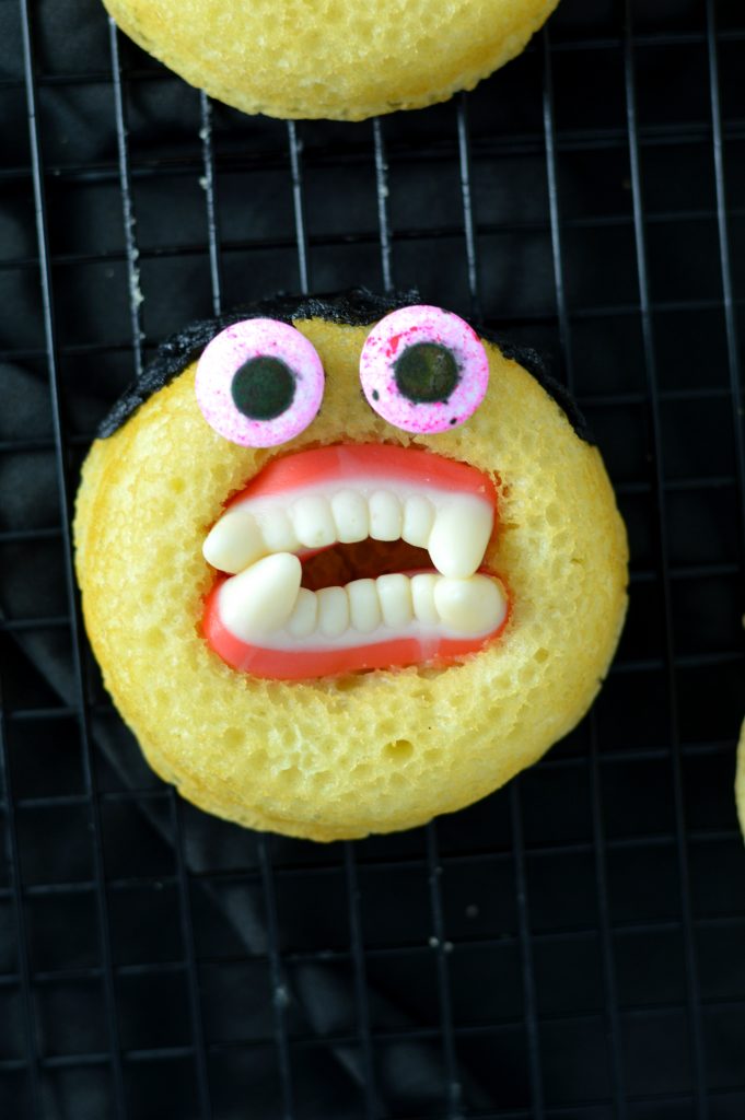 Halloween Baked Vampire Doughnuts recipe. Super quick and easy to make, this is so much fun for kids and adults alike.