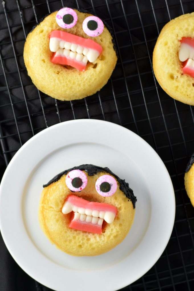 Halloween Baked Vampire Doughnuts recipe. Super quick and easy to make, this is so much fun for kids and adults alike.