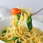 Healthy Spinach and Cherry Tomato Spaghetti. This pasta recipe is vegan and ready in under 30 minutes. Perfect for a quick and easy weeknight dinner idea.