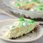 Easy St Patrick's Day Ice Cream Cake recipe. Made with prepared ice cream, weetabix and mint m&ms, this makes a great last minute dessert idea.