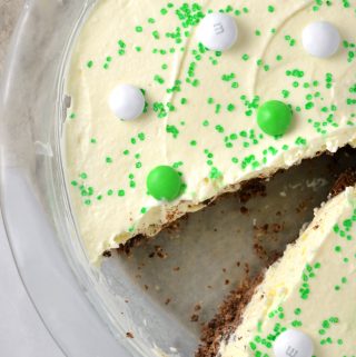 Easy St Patrick's Day Ice Cream Cake recipe. Made with prepared ice cream, weetabix and mint m&ms, this makes a great last minute dessert idea.