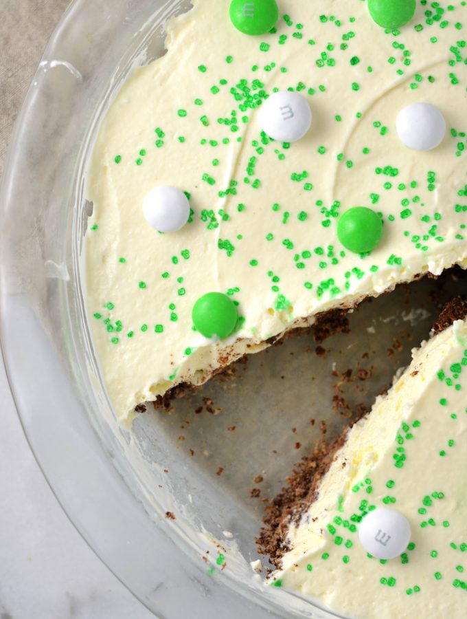 Easy St Patrick's Day Ice Cream Cake recipe. Made with prepared ice cream, weetabix and mint m&ms, this makes a great last minute dessert idea.