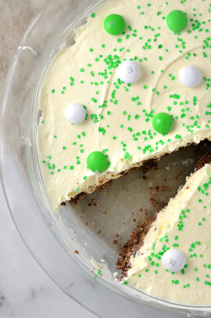 Easy St Patrick's Day Ice Cream Cake recipe. Made with prepared ice cream, weetabix and mint m&ms, this makes a great last minute dessert idea.