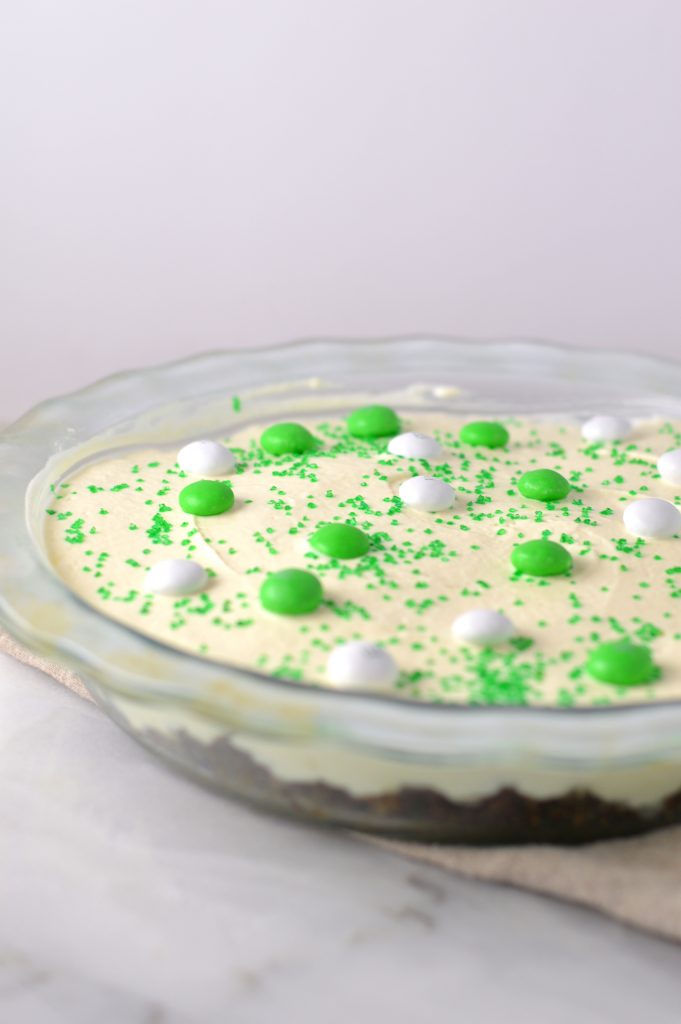 Easy St Patrick's Day Ice Cream Cake recipe. Made with prepared ice cream, weetabix and mint m&ms, this makes a great last minute dessert idea.