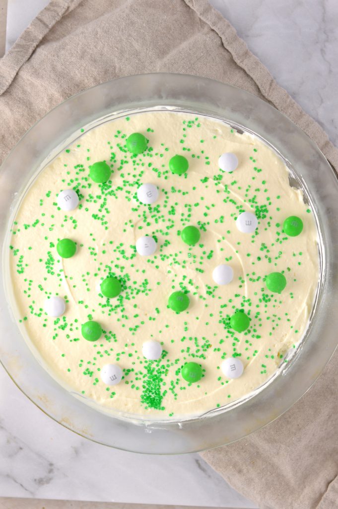 Easy St Patrick's Day Ice Cream Cake recipe. Made with prepared ice cream, weetabix and mint m&ms, this makes a great last minute dessert idea.