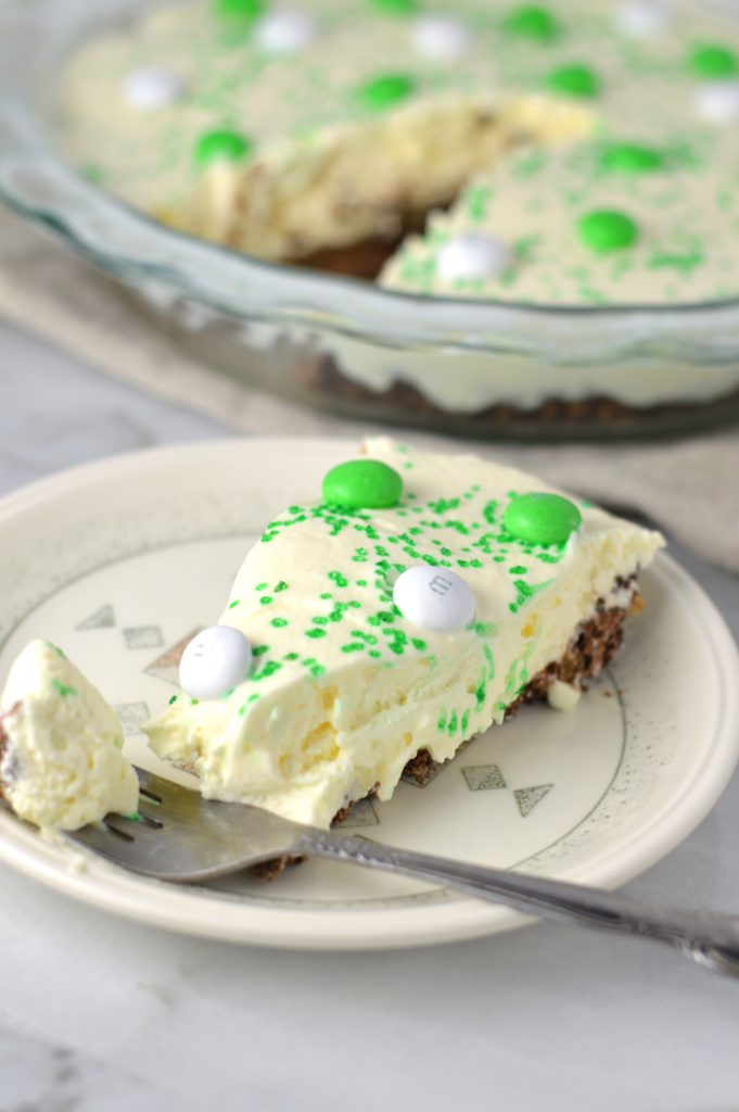 Easy St Patrick's Day Ice Cream Cake recipe. Made with prepared ice cream, weetabix and mint m&ms, this makes a great last minute dessert idea.