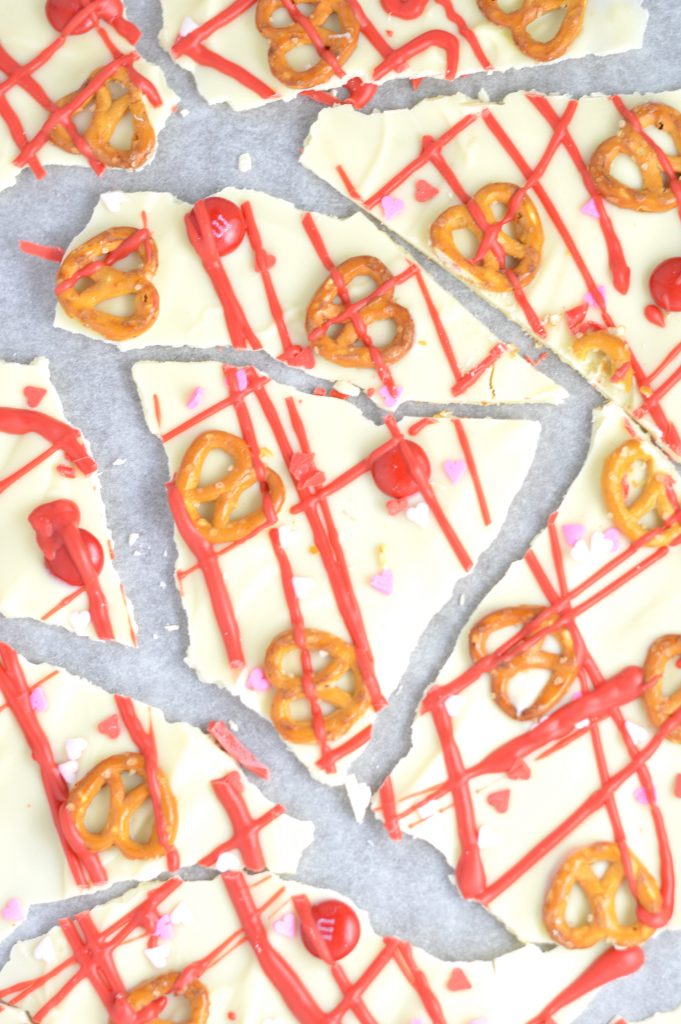 Super easy Valentine's Day Bark recipe. Made with white chocolate chips and 5 other ingredients, this is perfect for a last minute dessert idea.