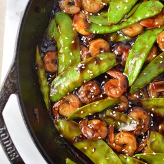 Easy Shrimp Stir Fry recipe with homemade honey garlic sauce. My go-to dinner idea when I have snow peas and shrimps in the fridge.