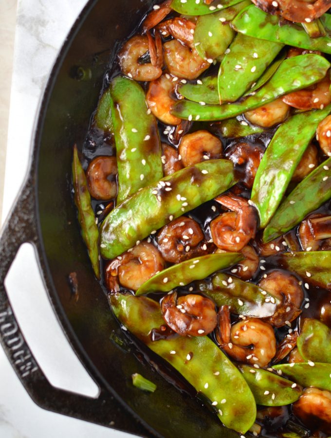 Easy Shrimp Stir Fry recipe with homemade honey garlic sauce. My go-to dinner idea when I have snow peas and shrimps in the fridge.