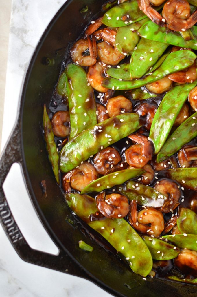 Easy Shrimp Stir Fry recipe with homemade honey garlic sauce. My go-to dinner idea when I have snow peas and shrimps in the fridge.