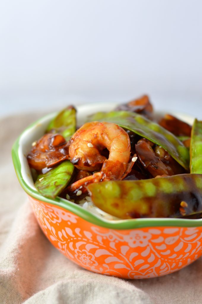 Easy Shrimp Stir Fry recipe with homemade honey garlic sauce. My go-to dinner idea when I have snow peas and shrimps in the fridge.