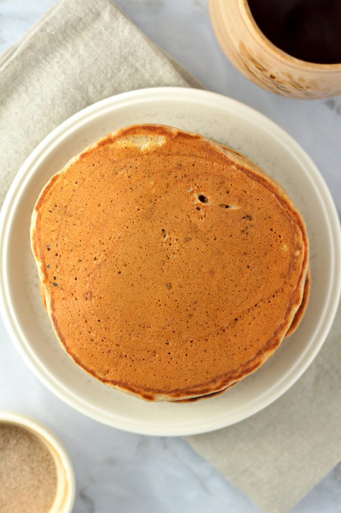 Easy recipe for Snickerdoodle Pancakes with Cinnamon Glaze. Light and fluffy, this is the perfect weekend breakfast idea.