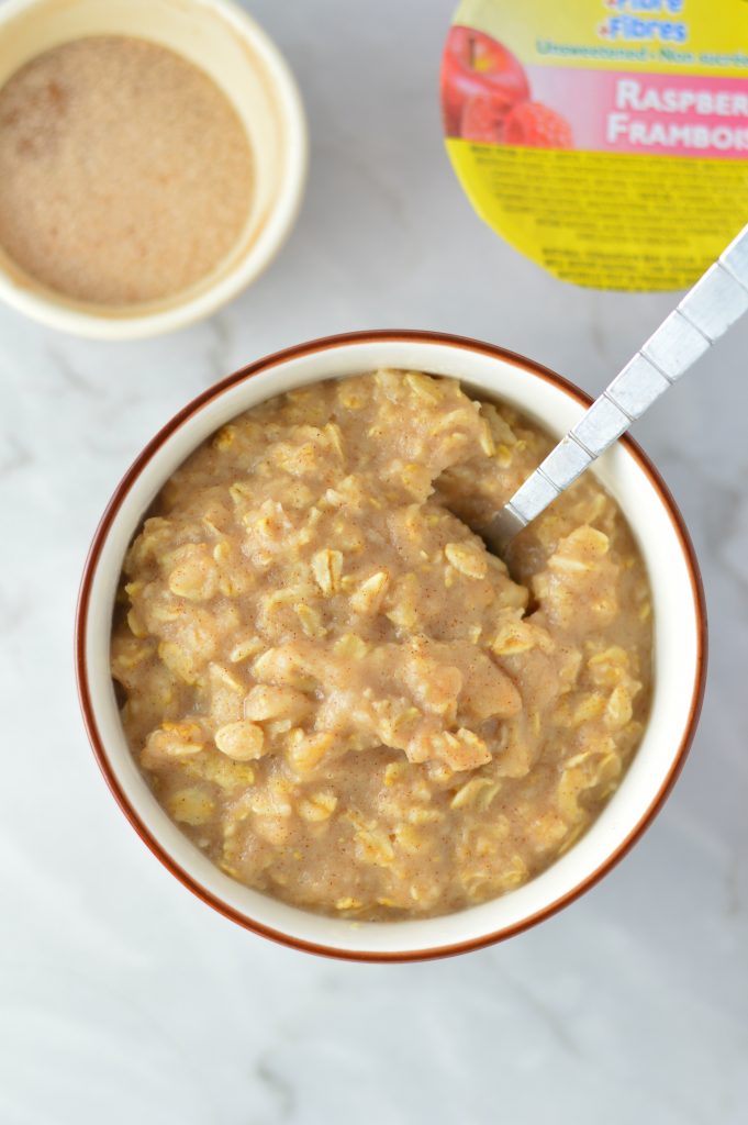 Easy Applesauce Oatmeal recipe. Perfect to use up leftover applesauce, this makes a quick and simple breakfast idea in only 4 ingredients.