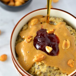 Healthy Peanut Butter and Jelly Oatmeal recipe. This porridge can be made vegan, it makes a great quick and easy breakfast idea.