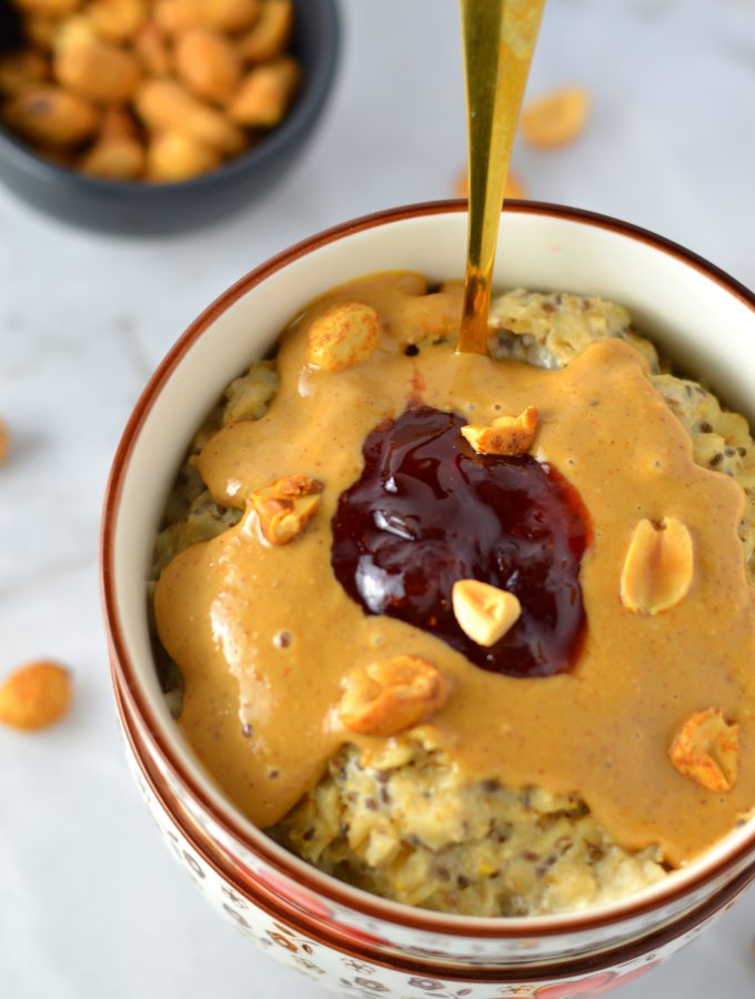 Healthy Peanut Butter and Jelly Oatmeal recipe. This porridge can be made vegan, it makes a great quick and easy breakfast idea.