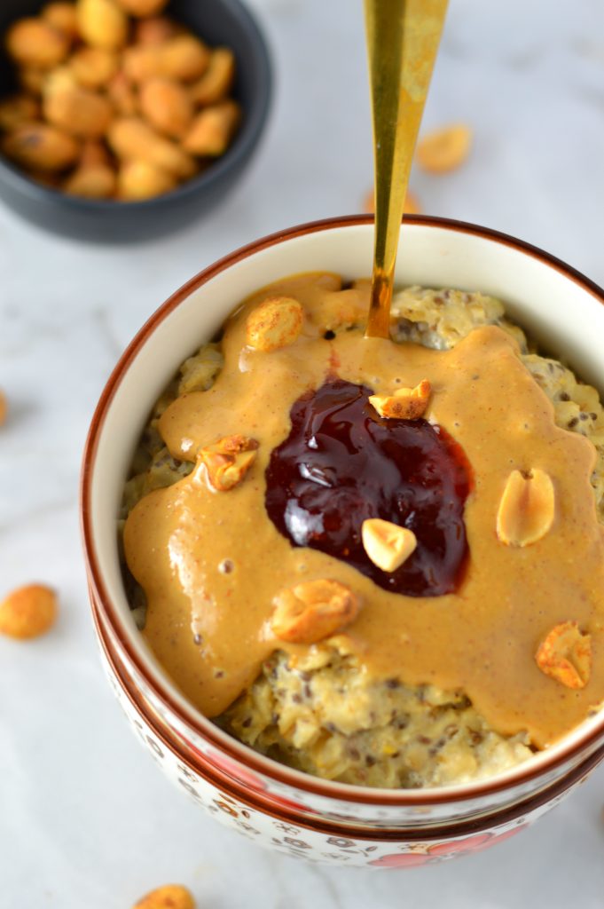 Healthy Peanut Butter and Jelly Oatmeal recipe. This porridge can be made vegan, it makes a great quick and easy breakfast idea.