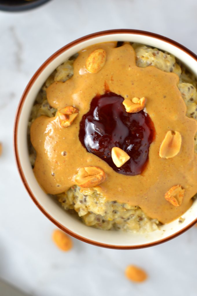 Healthy Peanut Butter and Jelly Oatmeal recipe. This porridge can be made vegan, it makes a great quick and easy breakfast idea.