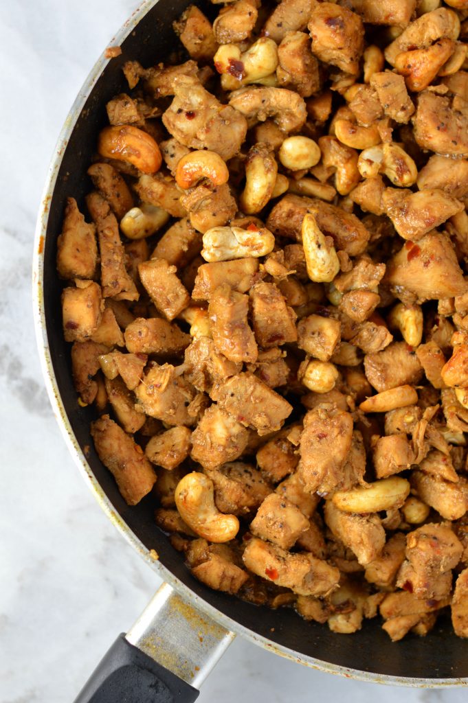 Easy Spicy Cashew Chicken recipe. Made with ingredients you probably have in your pantry, this makes a great weeknight dinner idea.