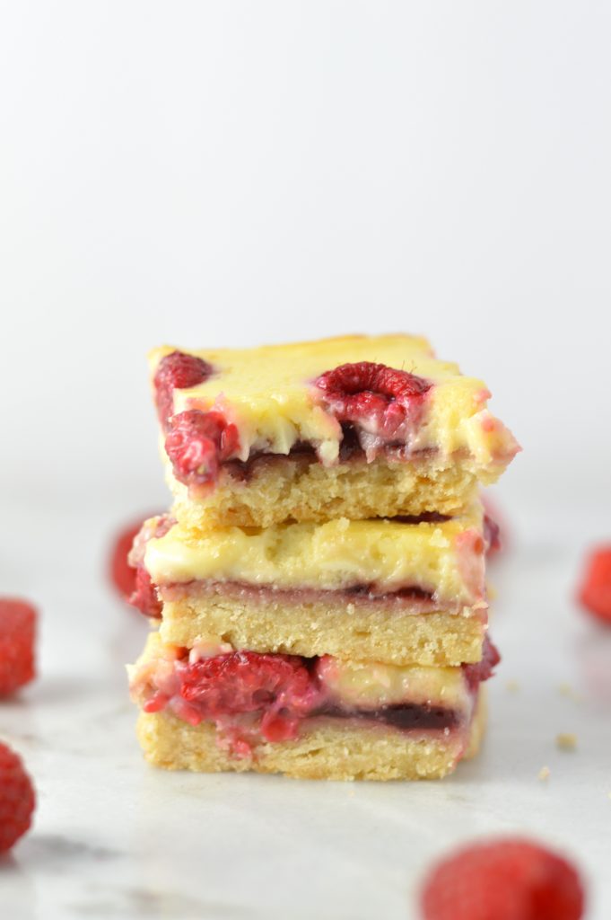 Easy Raspberry Cream Cheese Bars recipe. Made with fresh raspberries on top of a shortbread crust, tastes almost like cheesecake.