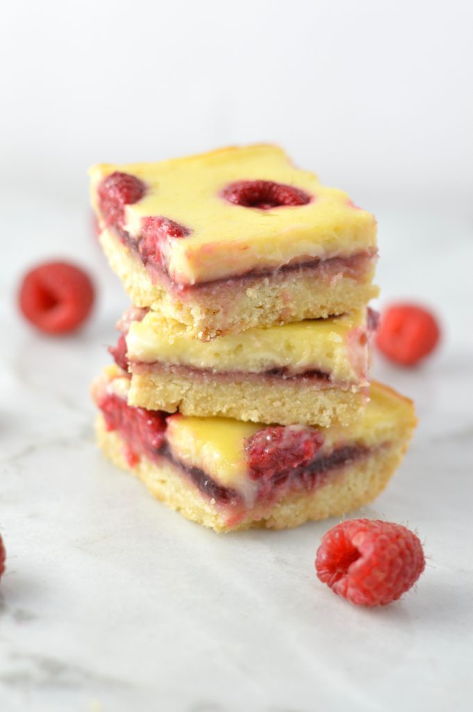 Easy Raspberry Cream Cheese Bars recipe. Made with fresh raspberries on top of a shortbread crust, tastes almost like cheesecake.