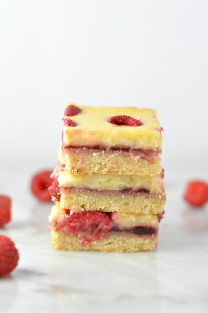 Easy Raspberry Cream Cheese Bars recipe. Made with fresh raspberries on top of a shortbread crust, tastes almost like cheesecake.