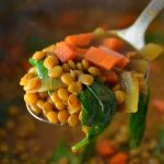 Easy Vegan Coconut Curry Lentil Soup recipe. Made with coconut milk and spinach, this makes a comforting meatless dinner idea.