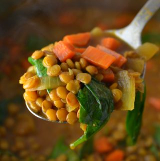 Easy Vegan Coconut Curry Lentil Soup recipe. Made with coconut milk and spinach, this makes a comforting meatless dinner idea.